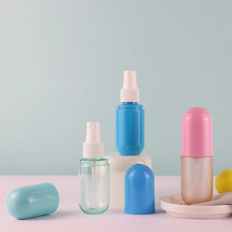 Wholesale 30ml 40ml 50ml 60ml 70ml 80ml 100ml PET Plastic Macaron Color Capsule Shaped Cosmetic Spray
