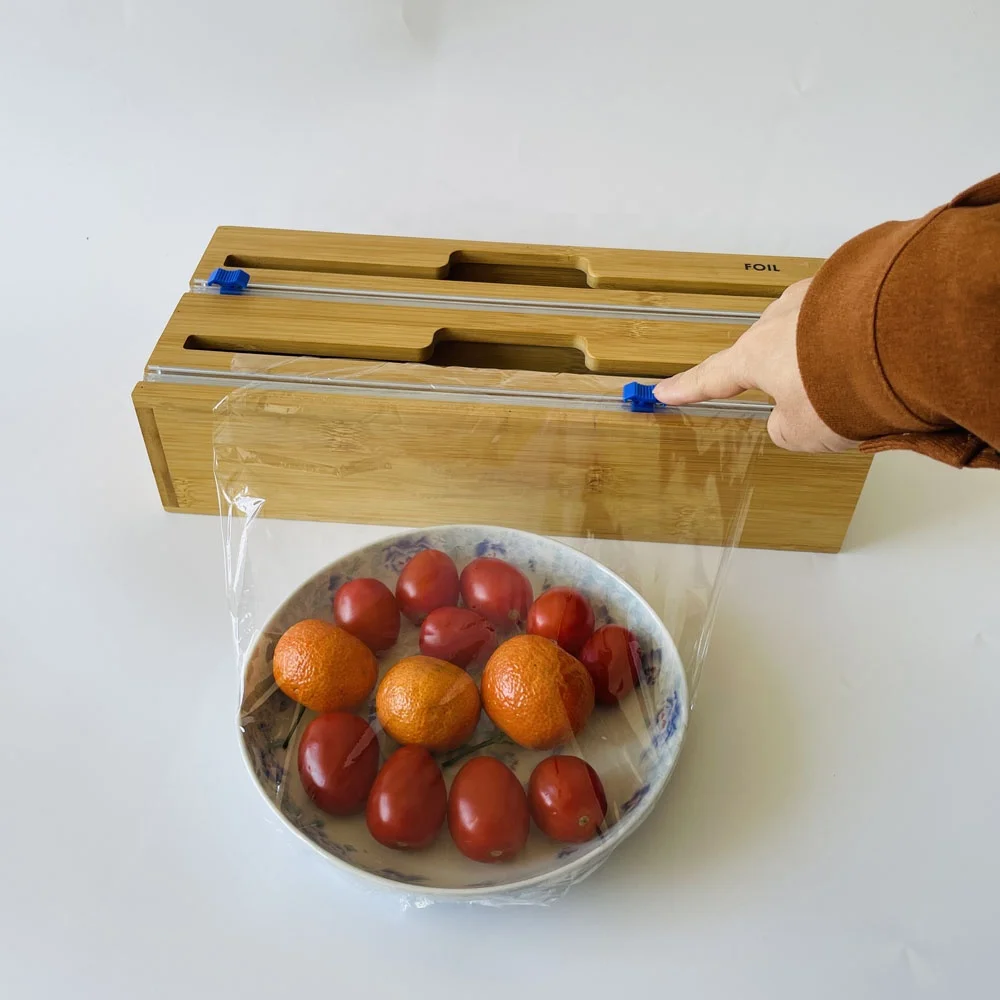 Kitchen accessories drawer wood bamboo roll organizer holder 2 in 1 foil and plastic wrap dispenser with cutter