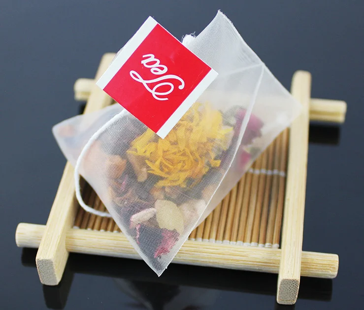 Disposable triangle nylon pyramid tea bags wholesale price tea bag with custom string