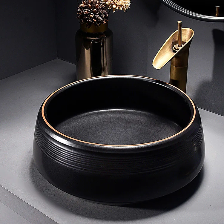 China Artistic Handmade Ceramic Wash Basin Round Counter Top Porcelain Sinks Carved Black Bathroom Sinks