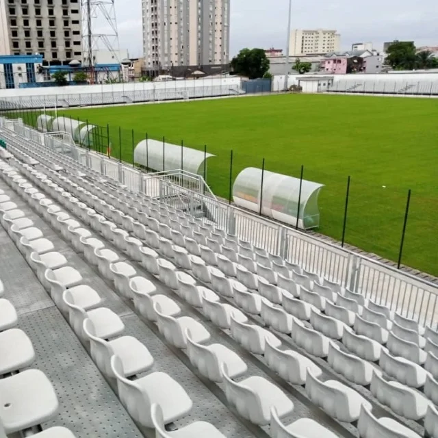 raised temporary bleacher outdoor stadium grandstand tribune with seating chairs metal structure