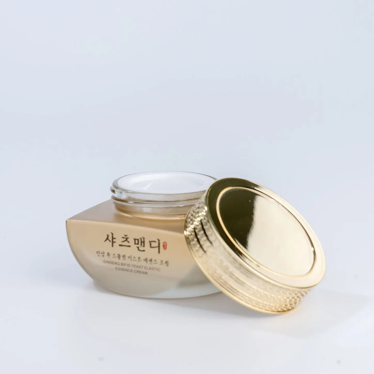 Factory Direct Wholesale 50g Cream Bottle Wide Round Design with Metallic Color Golden Gradient Lid Glass Cream Container