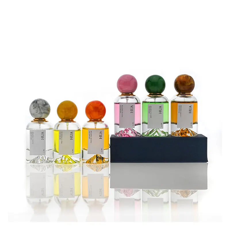 Luxury 50ml round glass perfume bottle with marble covered mountain bottom unique perfume bottle