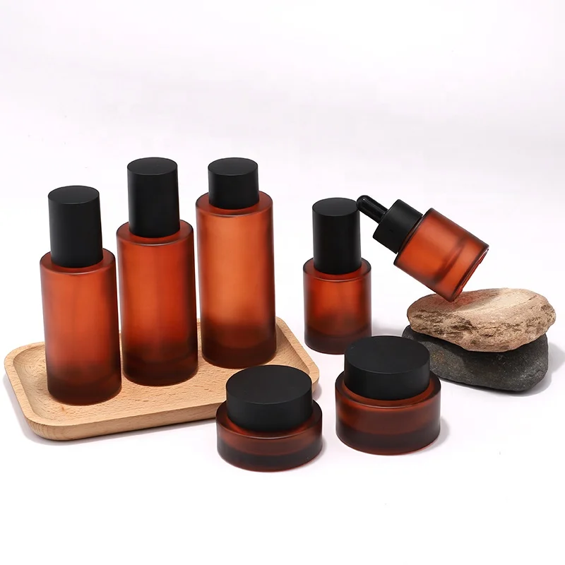 New Arrival Cosmetic Skincare Packaging Lotion Pump Bottle and Cream Jar Oil Dropper Toner Glass with Brown Frosted Amber Color
