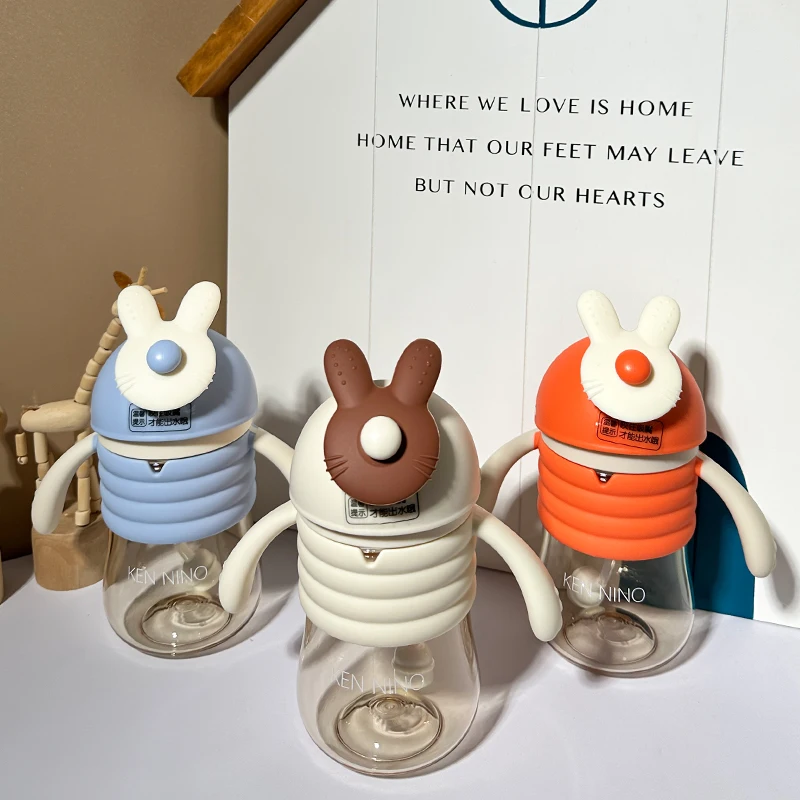 Hot Selling 300ml Baby Feeding Training Cup with Handle and Drinking Straw for Kids and Baby Water Bottle