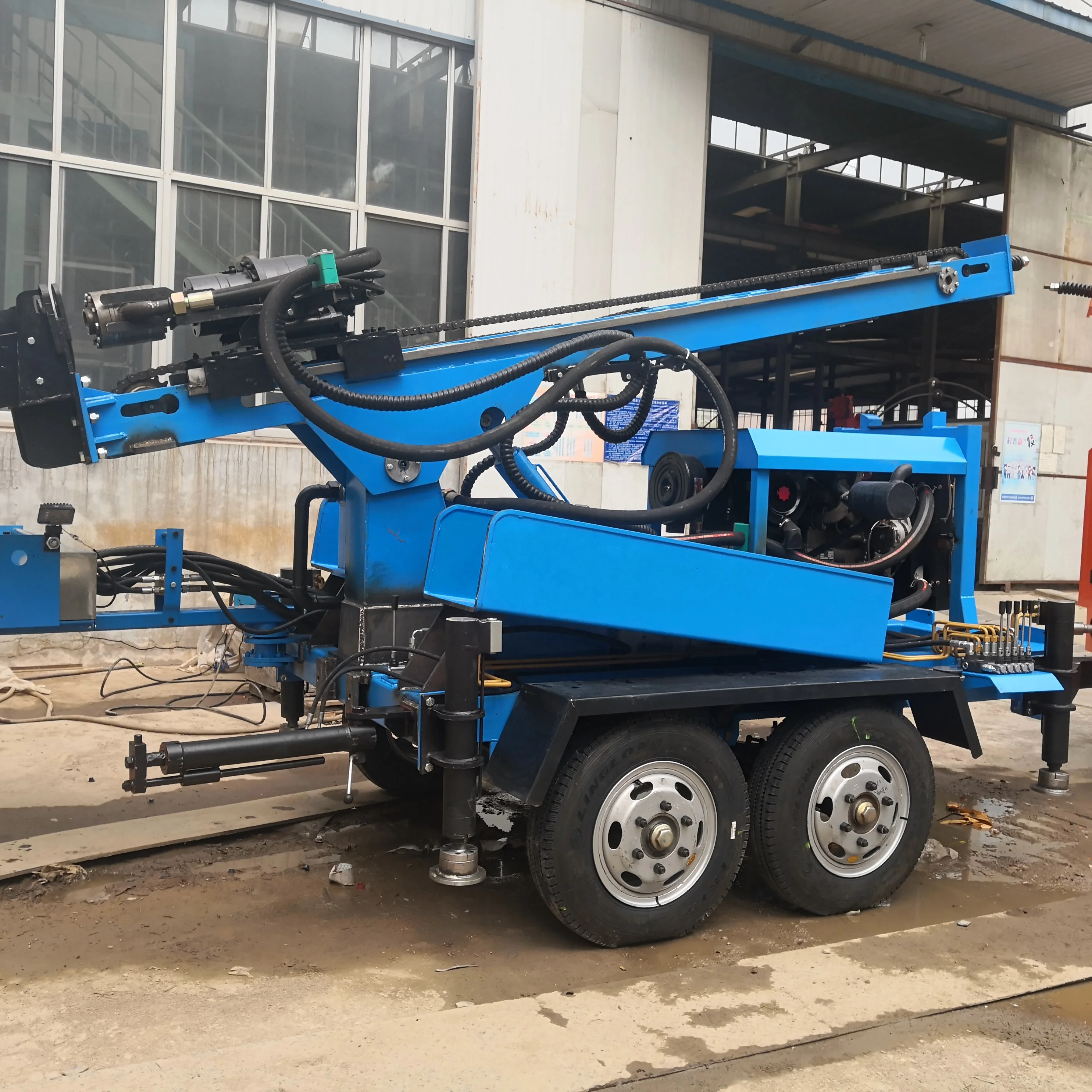 Trailer mounted water well drilling rig