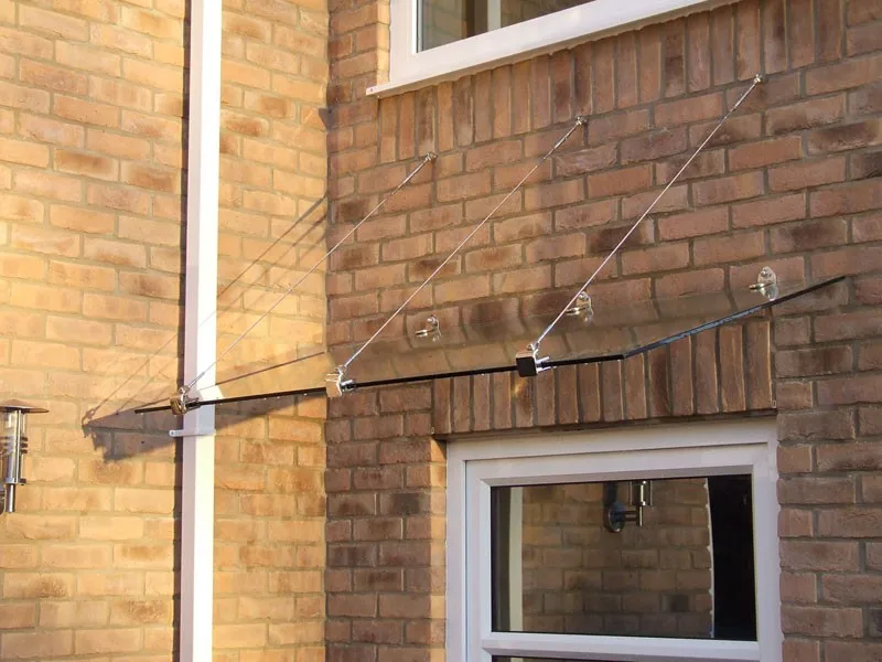 glass canopy with stainless steel support