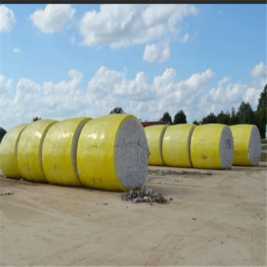 Yellow harvested cotton bales wrapped films