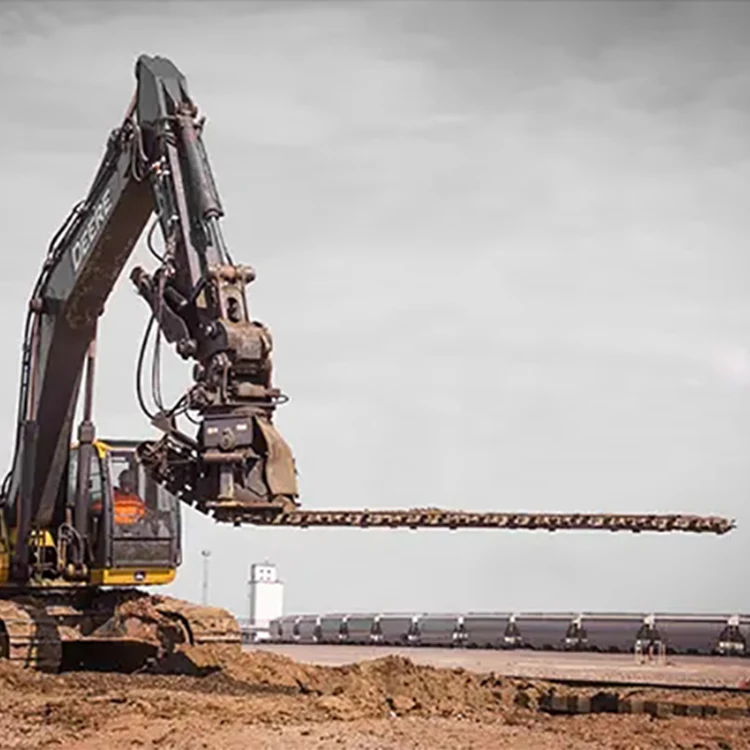 railway excavator with ballast undercutter removes fouled ballast from underneath the railway track
