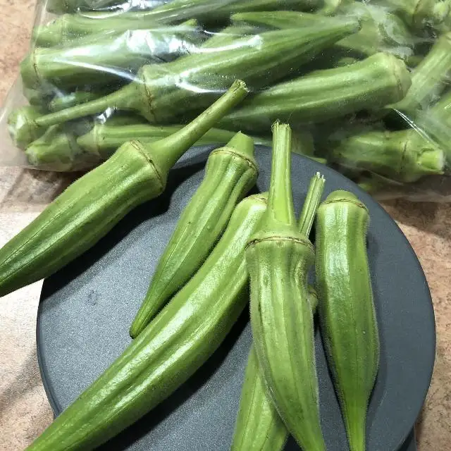 Fine Quality Fresh Green Lady Finger / Okra / Bhindi / Wholesale Cheap Price Seller From India Indian vegetable Seller .