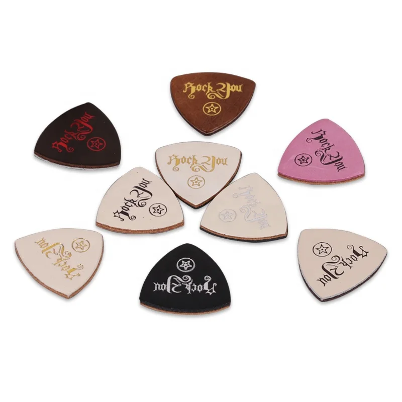 Playing ukelele with leather picks 3 pieces in random colors Pack of 3 tablets ukulele picks