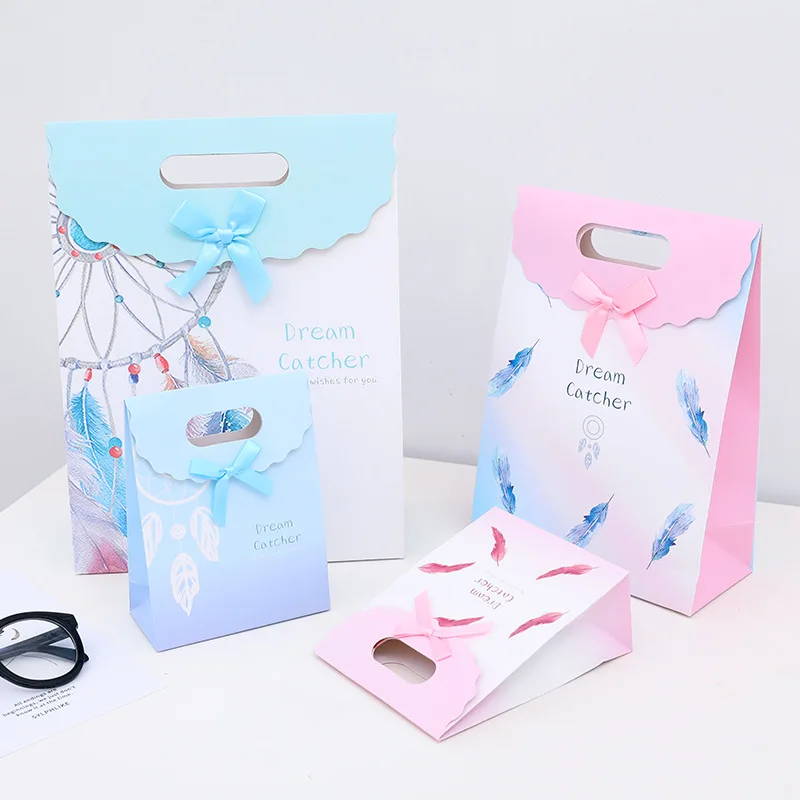 
New feather pattern clamshell high-end fashion clothing shopping tote bag gift white card paper bag customization spot 