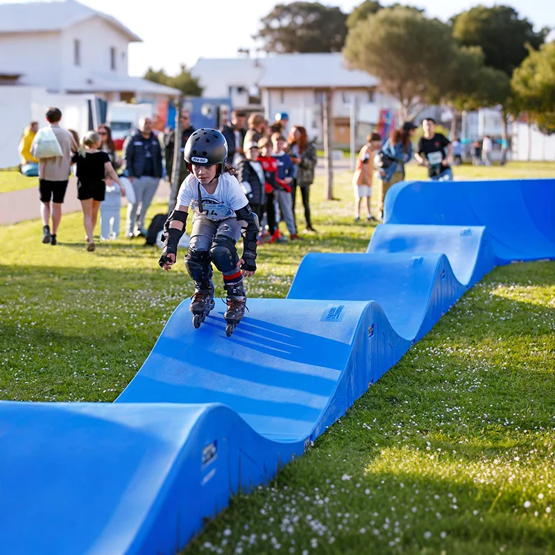 Plastic modular pump track velocity loop 2 is a sequence of roll overs  and berms  for bikes, BMX scooters and skateboards
