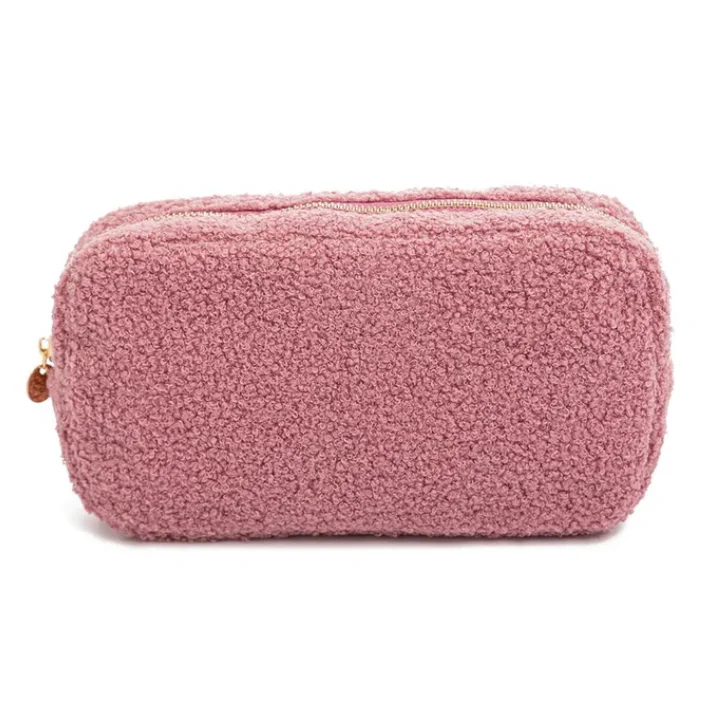 faux shearling pouch featuring a rectangle-shaped body and a zippered top handle