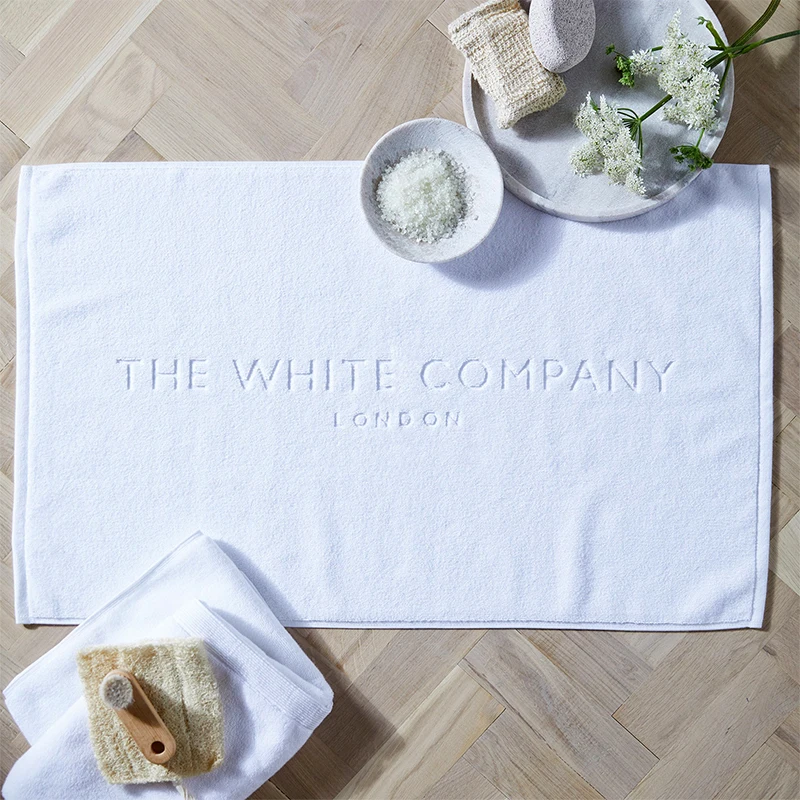 Оптовая продажа, пользовательский Жаккардовый Логотип, нескользящий белый Хлопковый махровый коврик для ванной для отеля, спа, ванной