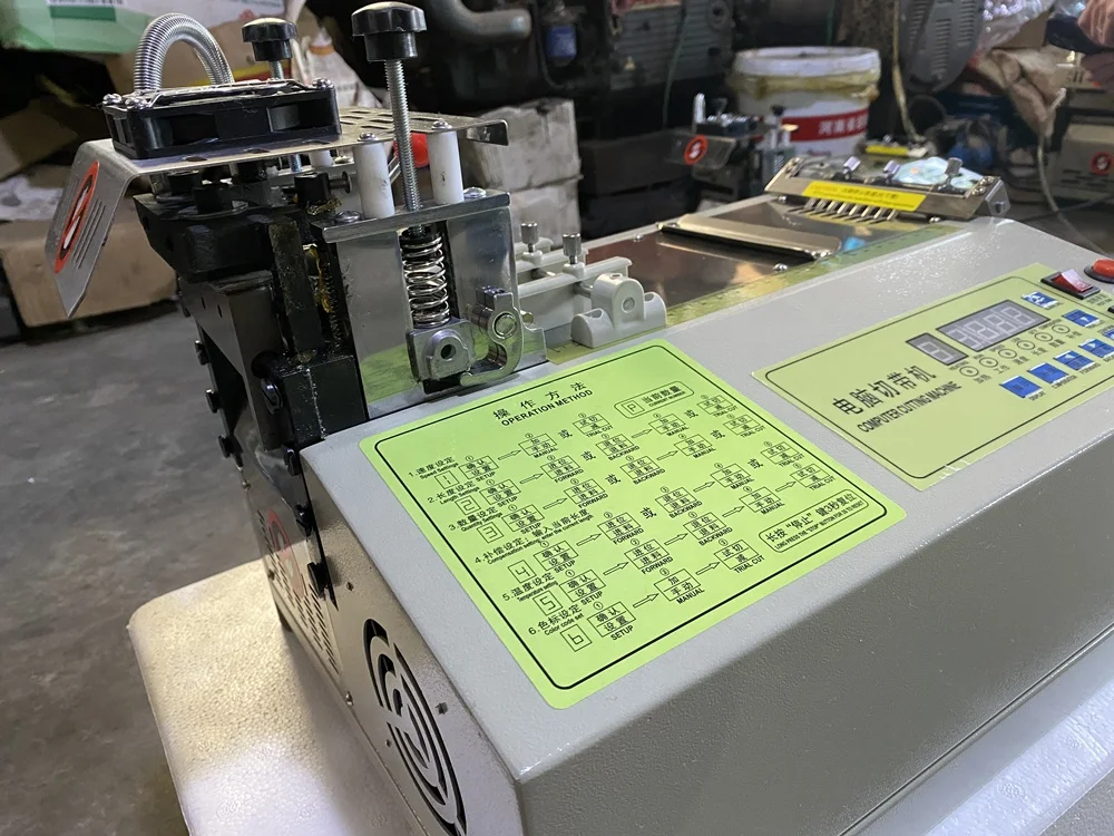 JK-110LR automatic electric webbing tape roll cutting machine leather belt ribbon conveyor strip rotary strap ribbon