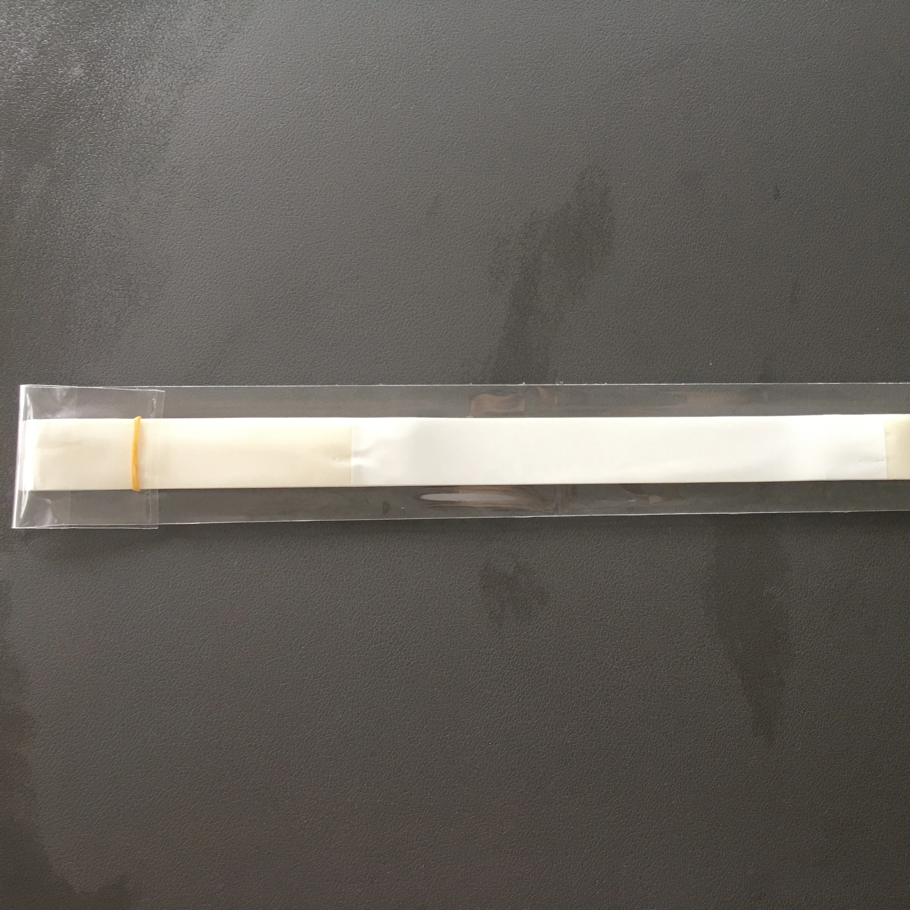 sturdy white plastic strips with high tack adhesive on each end are convenient for all packages packed 25 pieces per PE bags