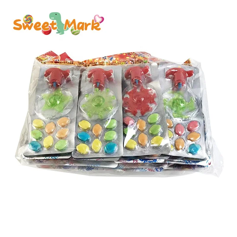 OEM candy toy funny spinning gun plaything and mix fruit press candy