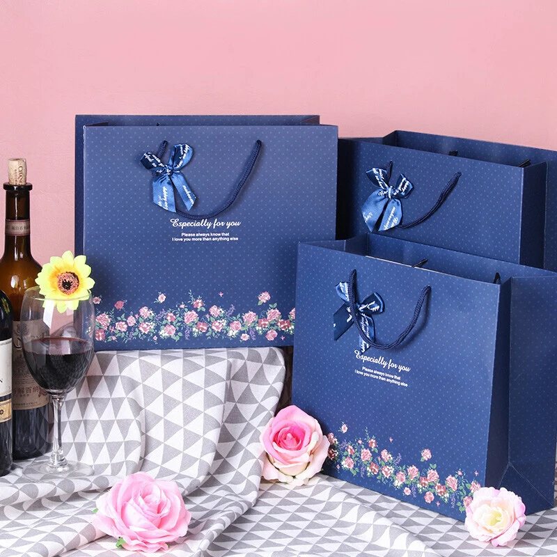 Luxury brand custom logo gift paper bag for clothes blue matte garment clothing boutique packaging bags with ribbon bow