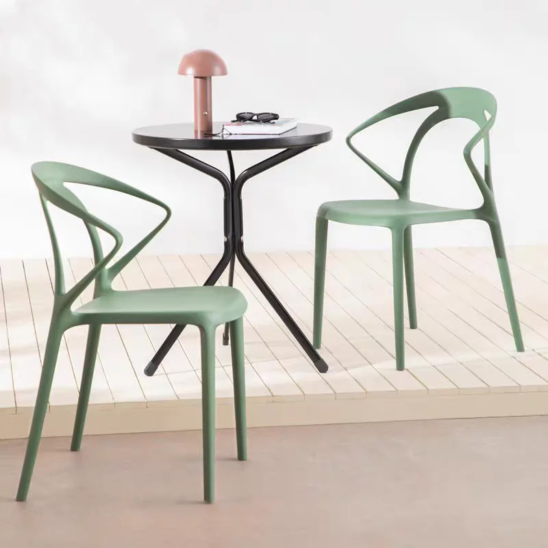 Patented factory modern stacking designer hole back black white pp stackable dining plastic chair for sale