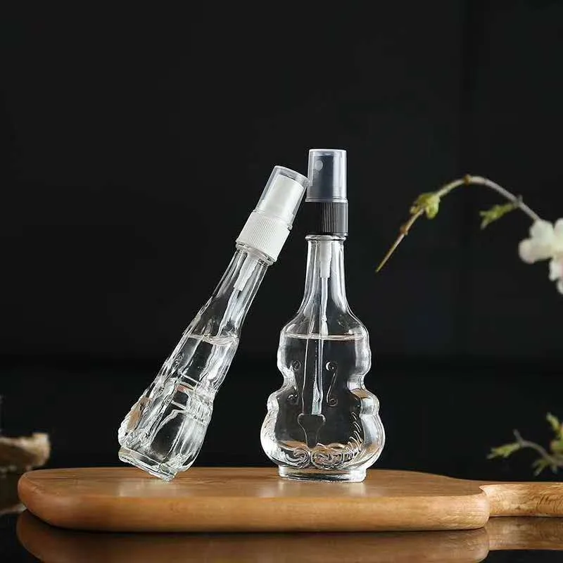 
Creative transparent glass spray bottle, violin perfume bottle Mini spot portable cosmetic packaging sub bottling 