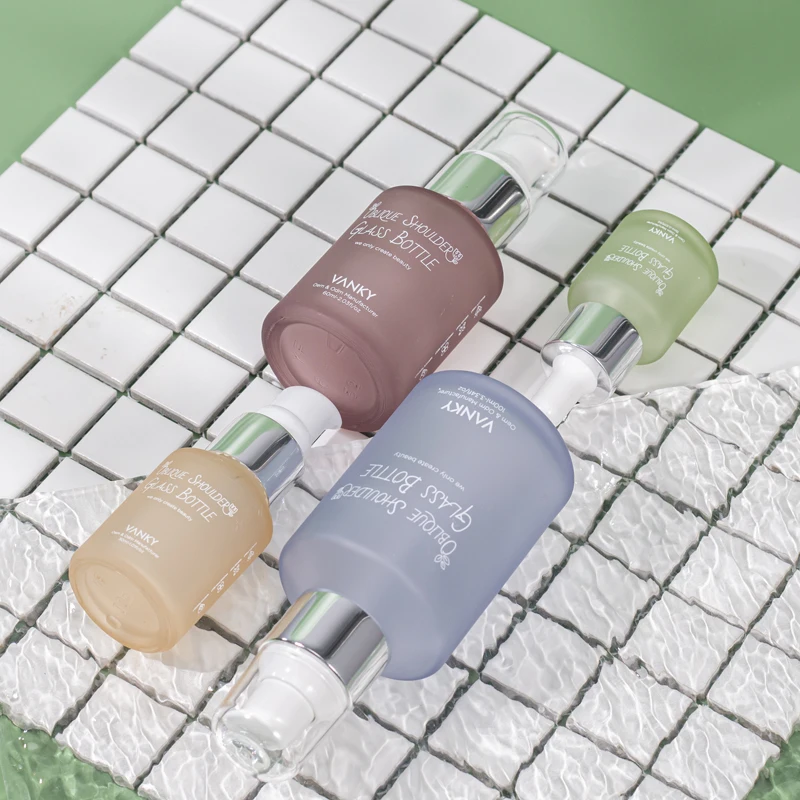 New Design Luxury 30ml 60ml 100ml Oblique Shoulder Bottle Customized Green Serum Essential Oil Dropper Glass Bottle With Pump