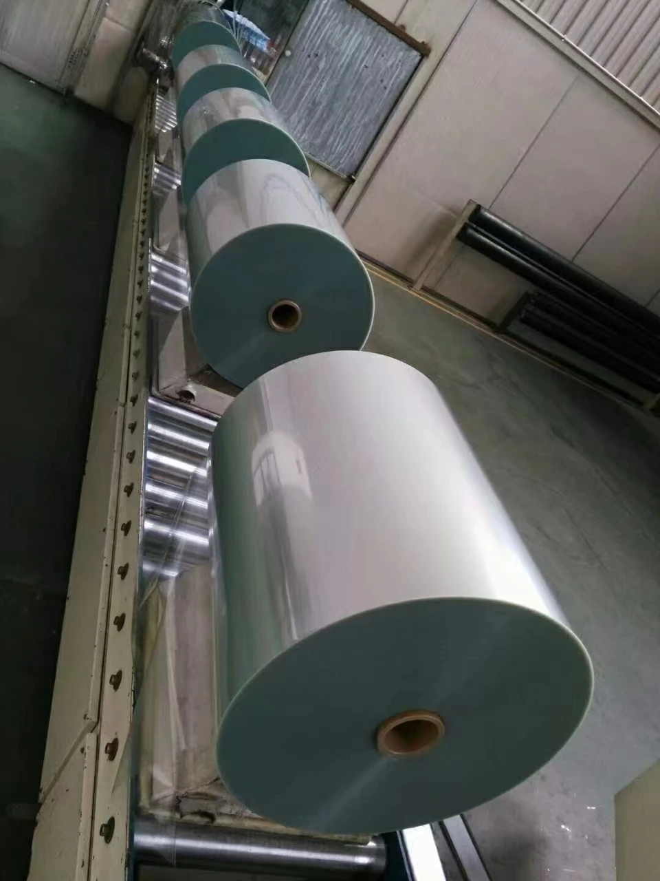 Bopet pet film 19 20 25 50 100 micron thickness anti-uv Heat sealing with corona in roll for frp fiberglass sheet making price