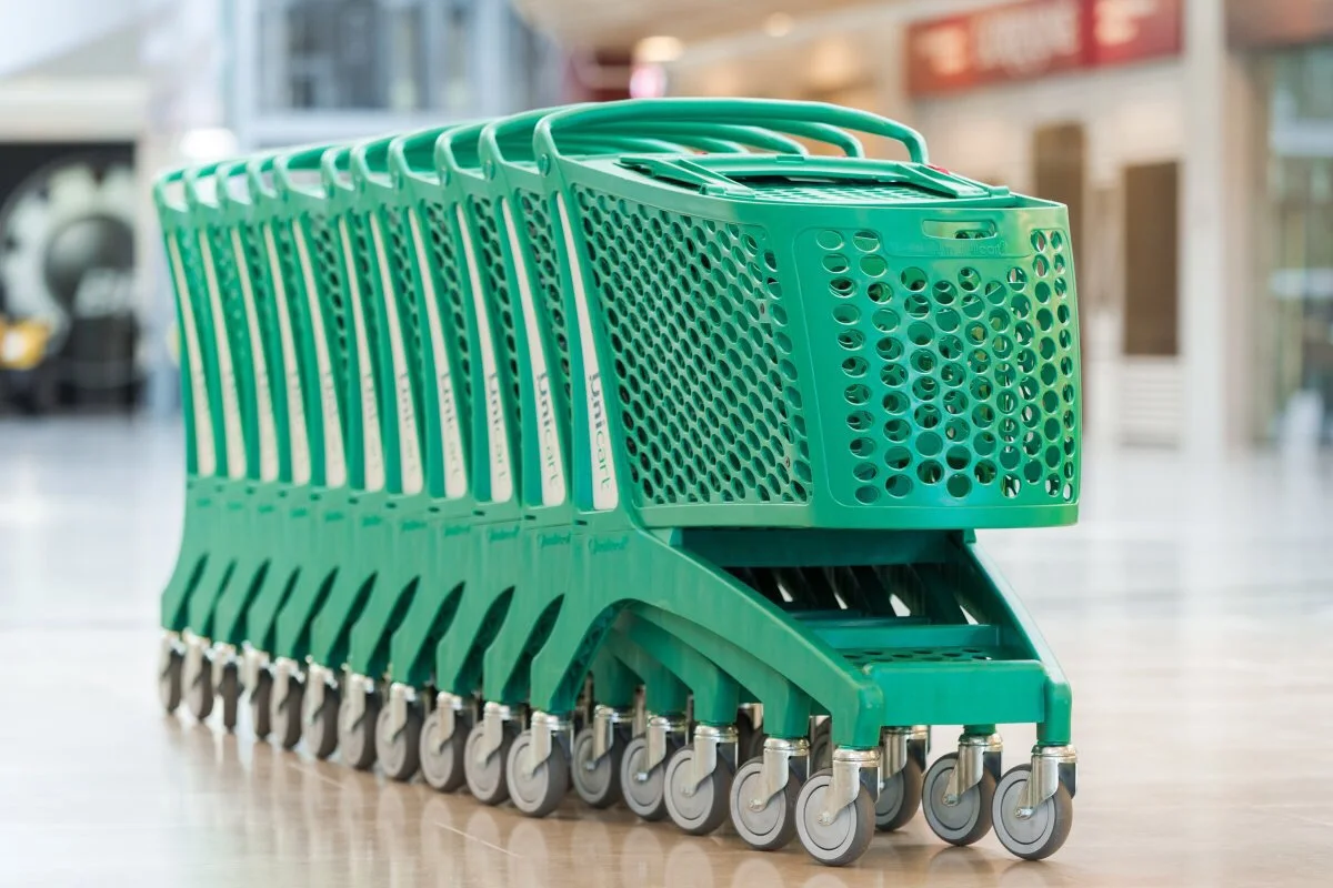 New product hand pushing commercial convenience trolley supermarket shopping cart