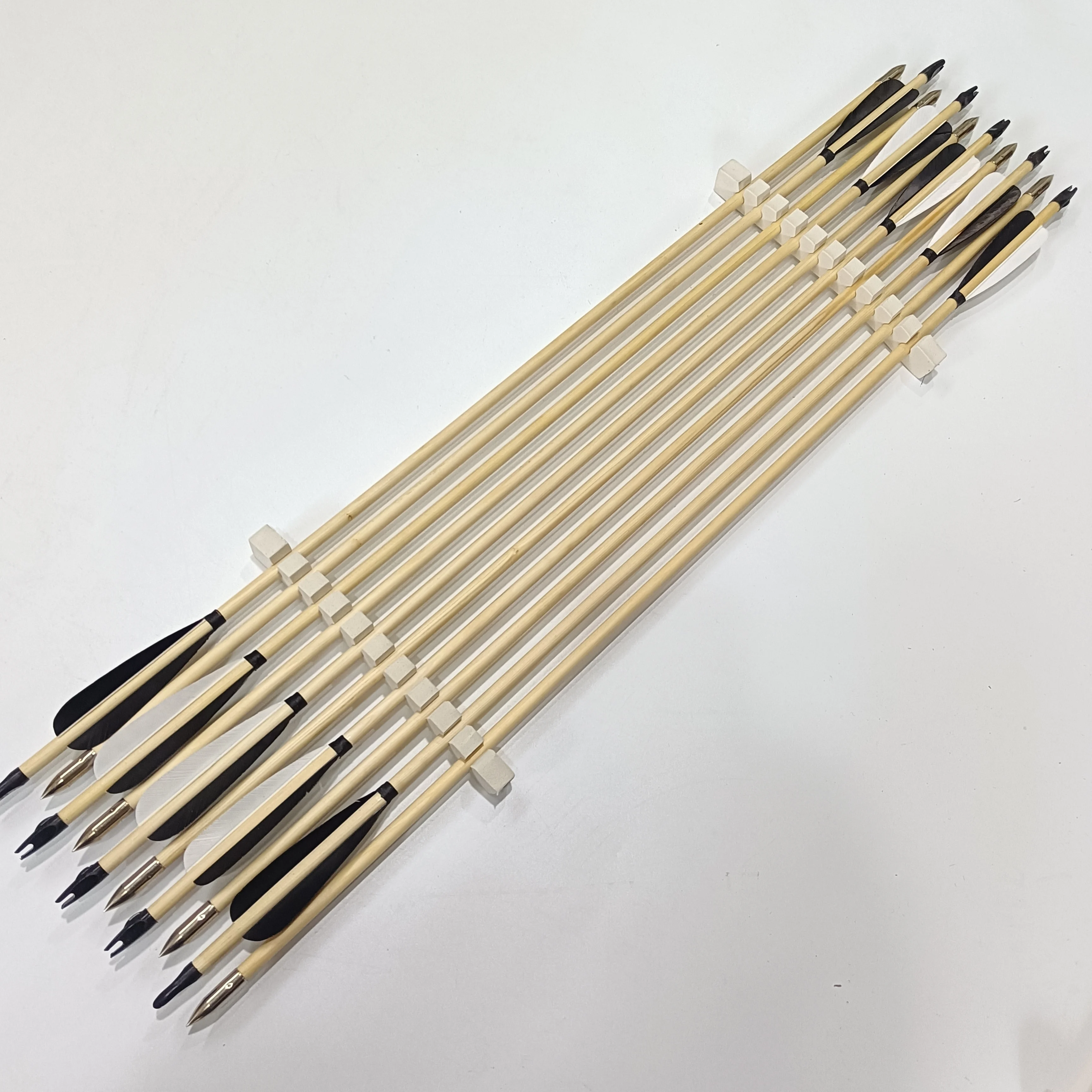 hunting wood arrows handmade wooden arrow shafts white and black plain feathers silver arrow tips archery traditional  hunting