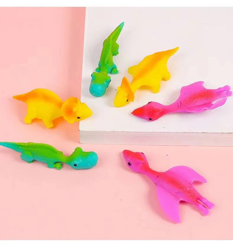 Novelty Funny rubber animal Dinosaur Slingshot finger flying toy Stretchable elastic soft shooting toy