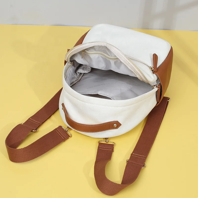 Mini canvas and vegan leather diaper bags multifunction baby bags including changing mat and stroller straps