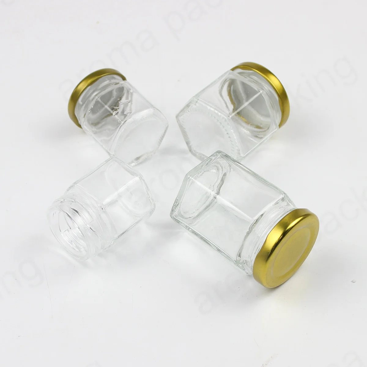 Wholesale 30ml 50ml 60ml Clear Glass Storage Jar Hexagon Kitchen Glass Bottle Round Glass Honey Jar  With Gold Lids
