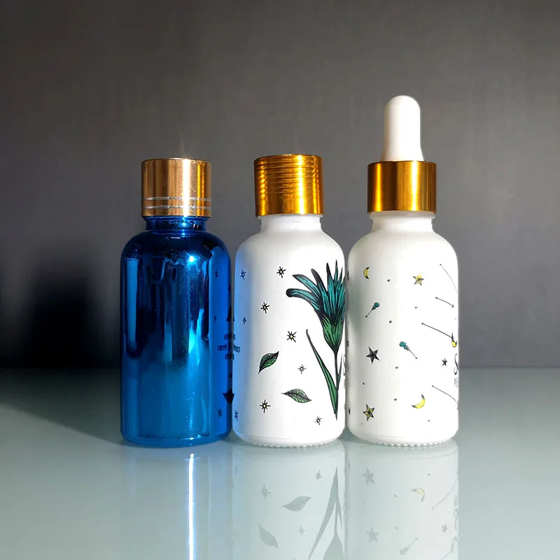 Hot sale luxury custom 10Ml 30ml frosted matte white cosmetic glass serum essential oil bottle with gold dropper and paper tube