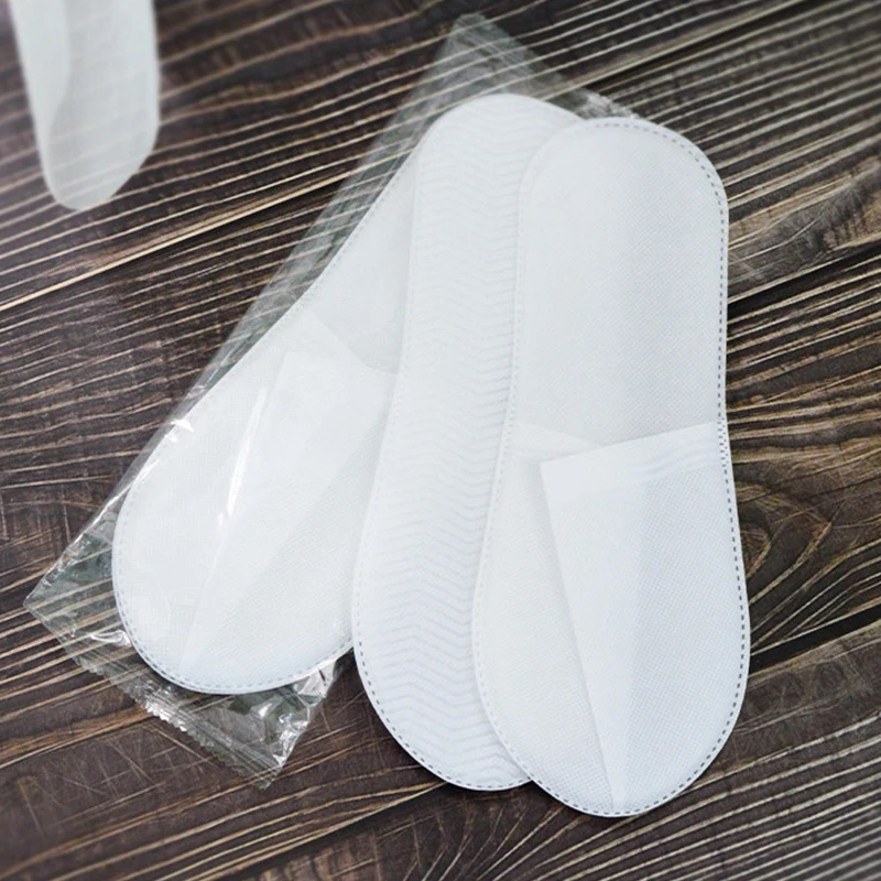 Wholesale cheap price non-woven fabric disposable slippers eco friendly sole spa and hotel slippers