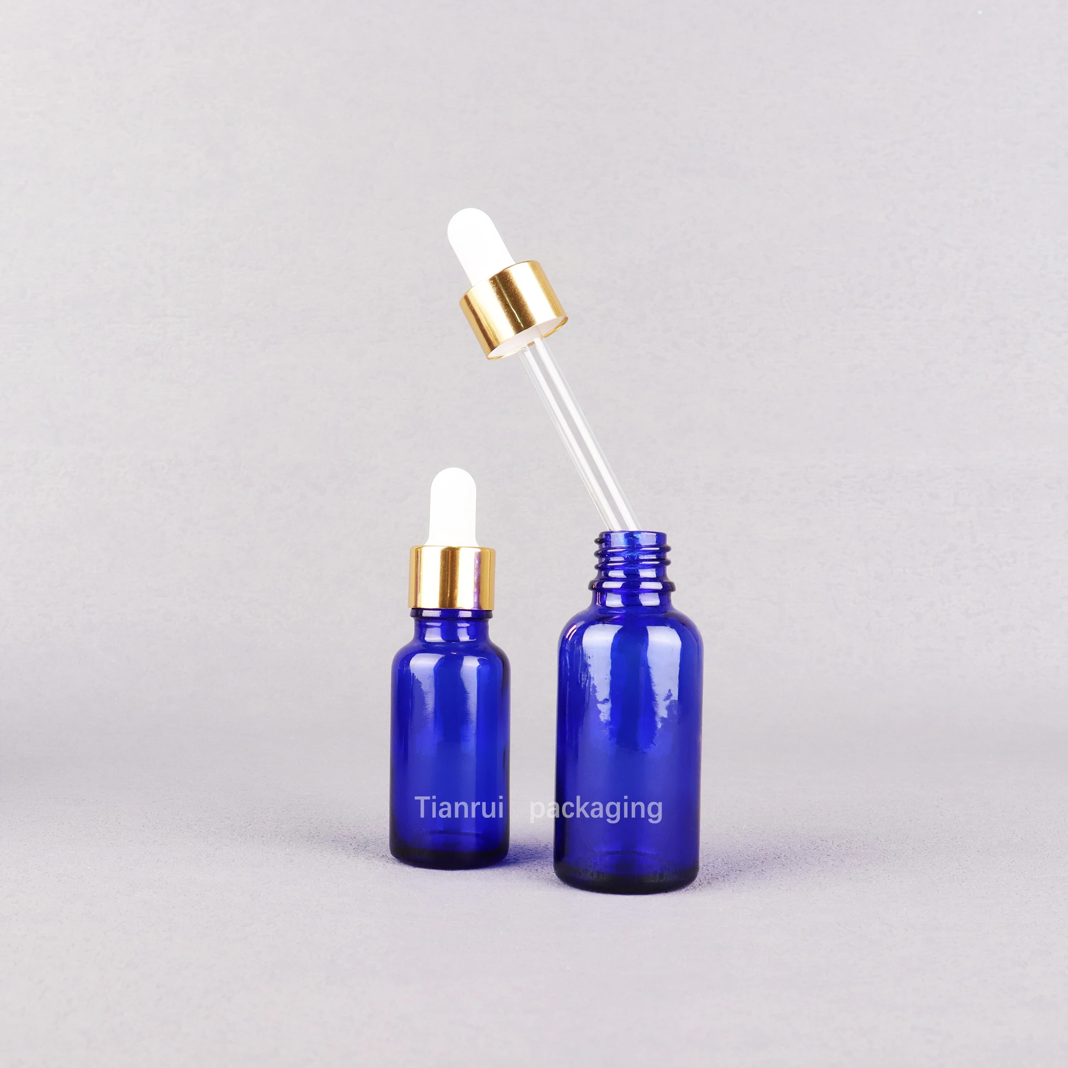 Low MOQ Essential Oil Product Container Colored Glass Dropper Bottles 5 10 15 20 30 50 100ml 2 oz Blue Serum Bottles
