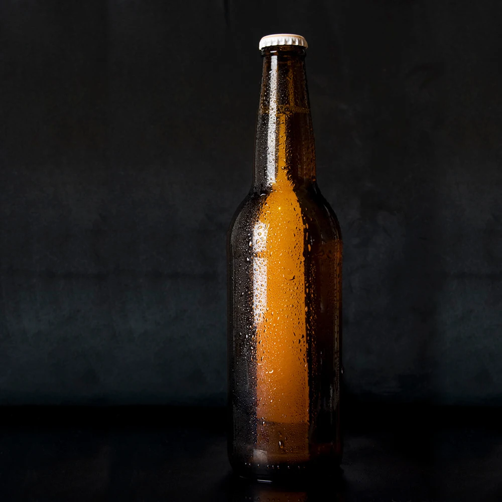 Factory low price high quality beer bottle glass bottle with lid