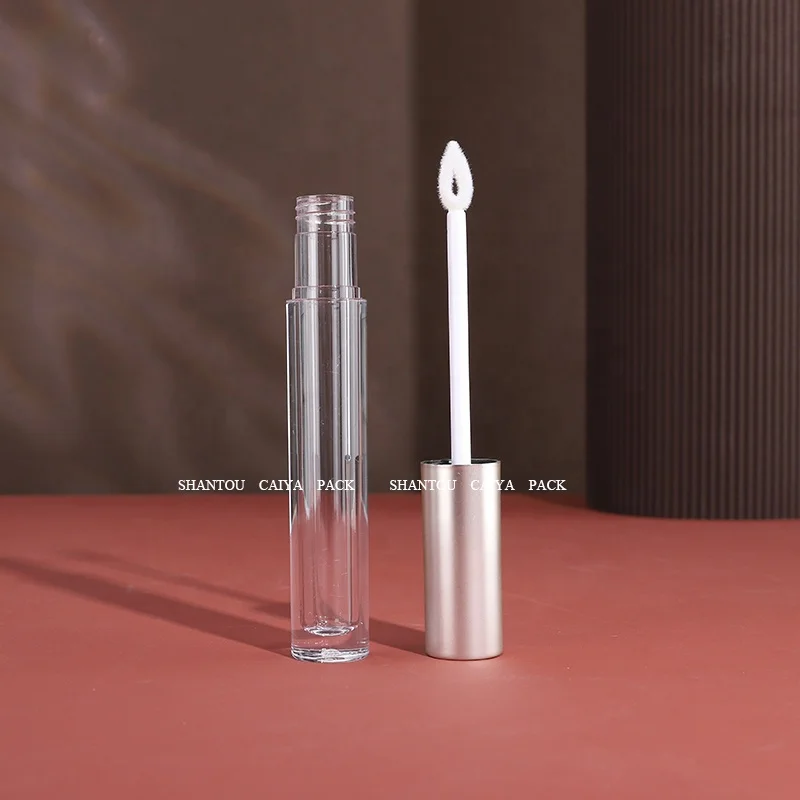 Shantou cosmetic packaging manufacturer wholesale 3ml long neck empty frost black silver round lip gloss balm tube heart brush