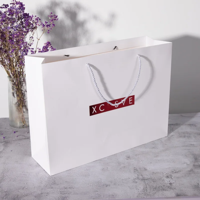 Custom Luxury Clothing Retail Packing Bag White Gift Bag bolsas de papel Shopping Packaging Paper Bags With Handles For Clothes