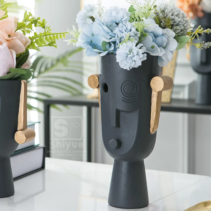 Wholesale 2021 home decor black resin face flower vase