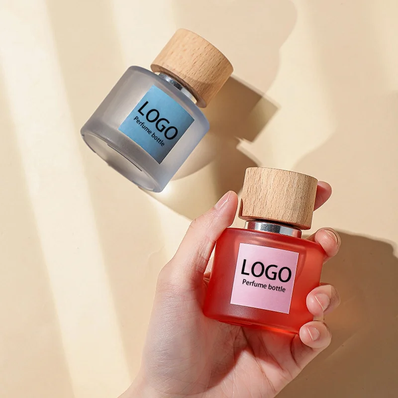 Design Luxury Custom LOGO Fragrance Pump Spray 50ml Round Sprayer Empty Oil Glass Perfume Bottles Packaging