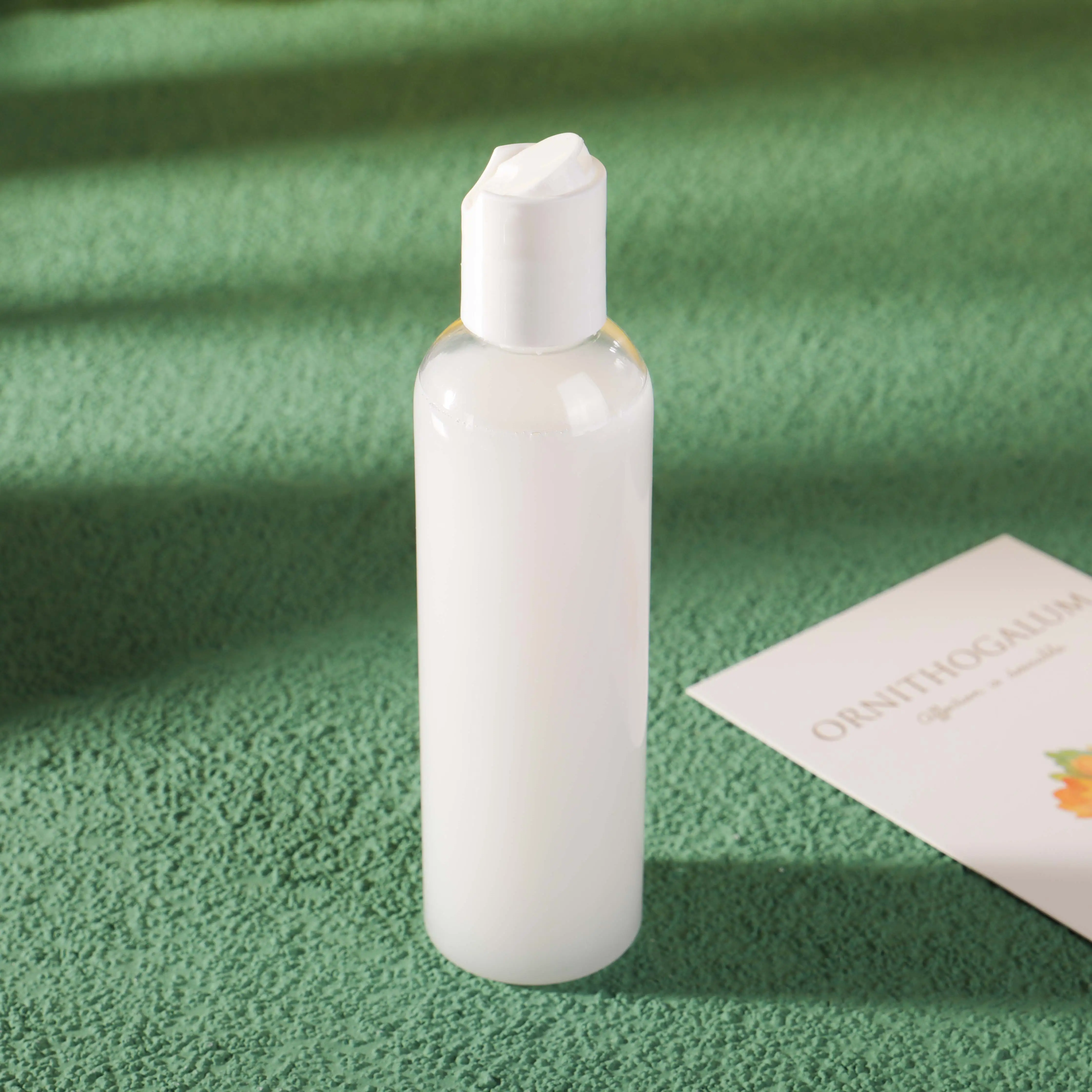 60ml 2oz 120ml 4 ounce Refillable with Black Press Down Disc Cap PET RPET Round Cosmo Plastic Bottle with Twist Tops