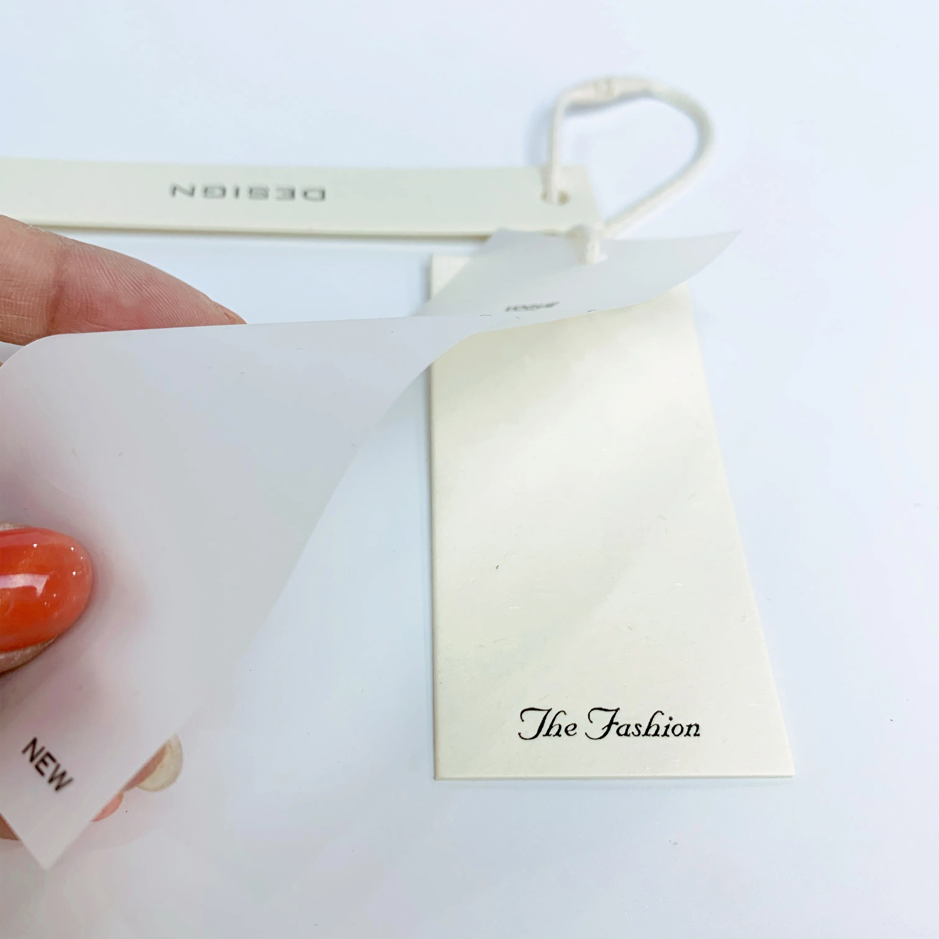 Custom clothing paper swing hanging tags lables translucent embossed pvc luxury printed logo garment hang tag with sting