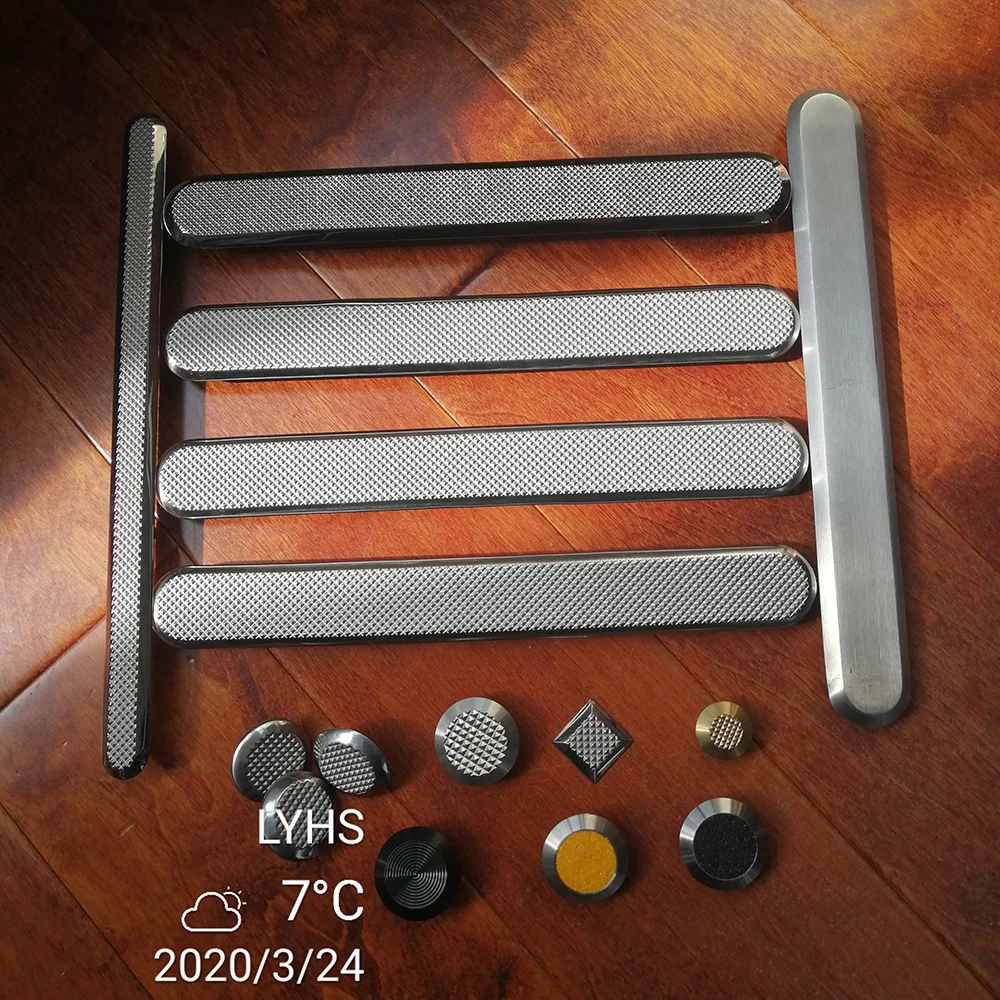 Stainless steel studs tactile paving textured surface for blind or visually impaired people at a pedestrian crossing