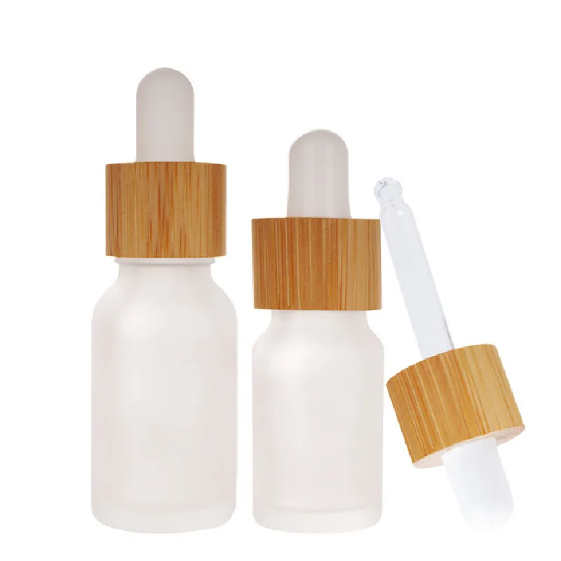 Competitive price Frosted 5ml 10ml 15ml 30ml round glass bottle cosmetics glass oil bottle with bamboo dropper lid