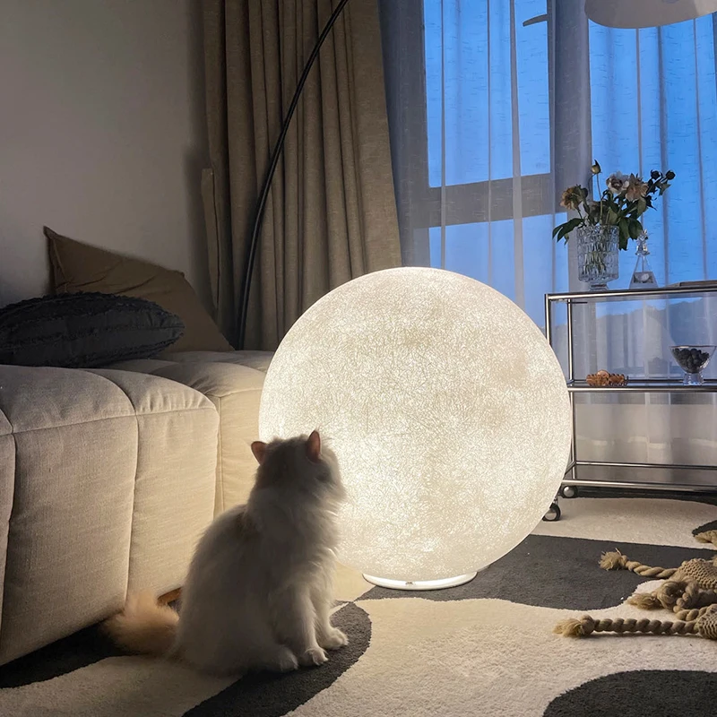 Nordic living room sofa next to the atmosphere lamp creative moon floor lamp