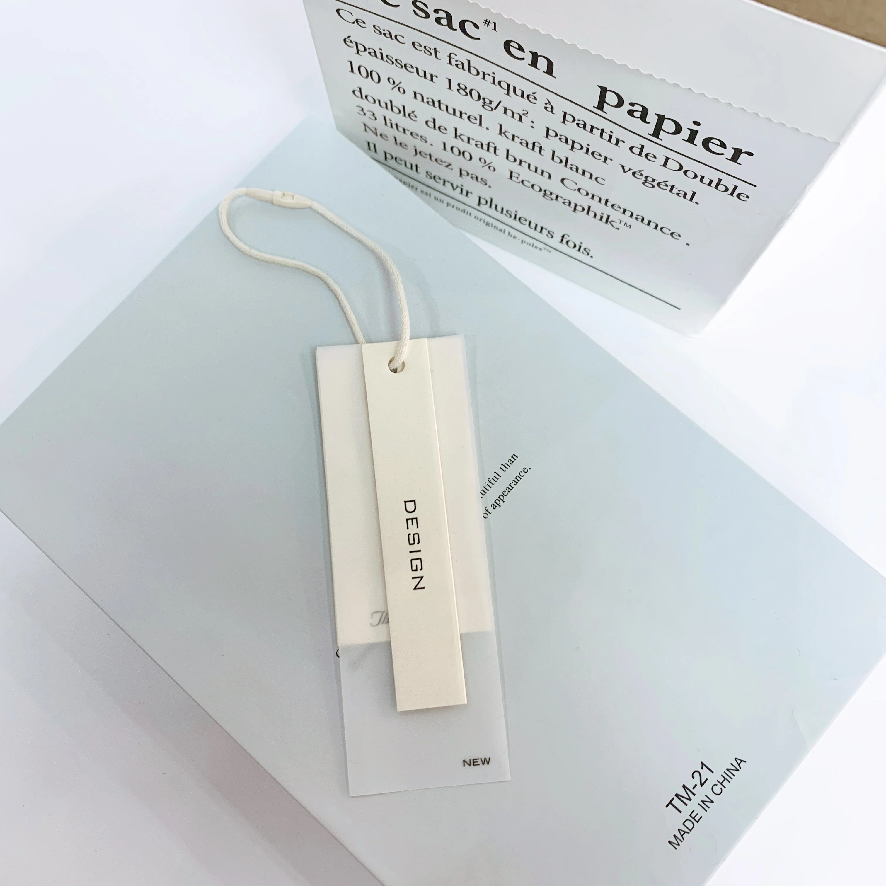 Custom clothing paper swing hanging tags lables translucent embossed pvc luxury printed logo garment hang tag with sting