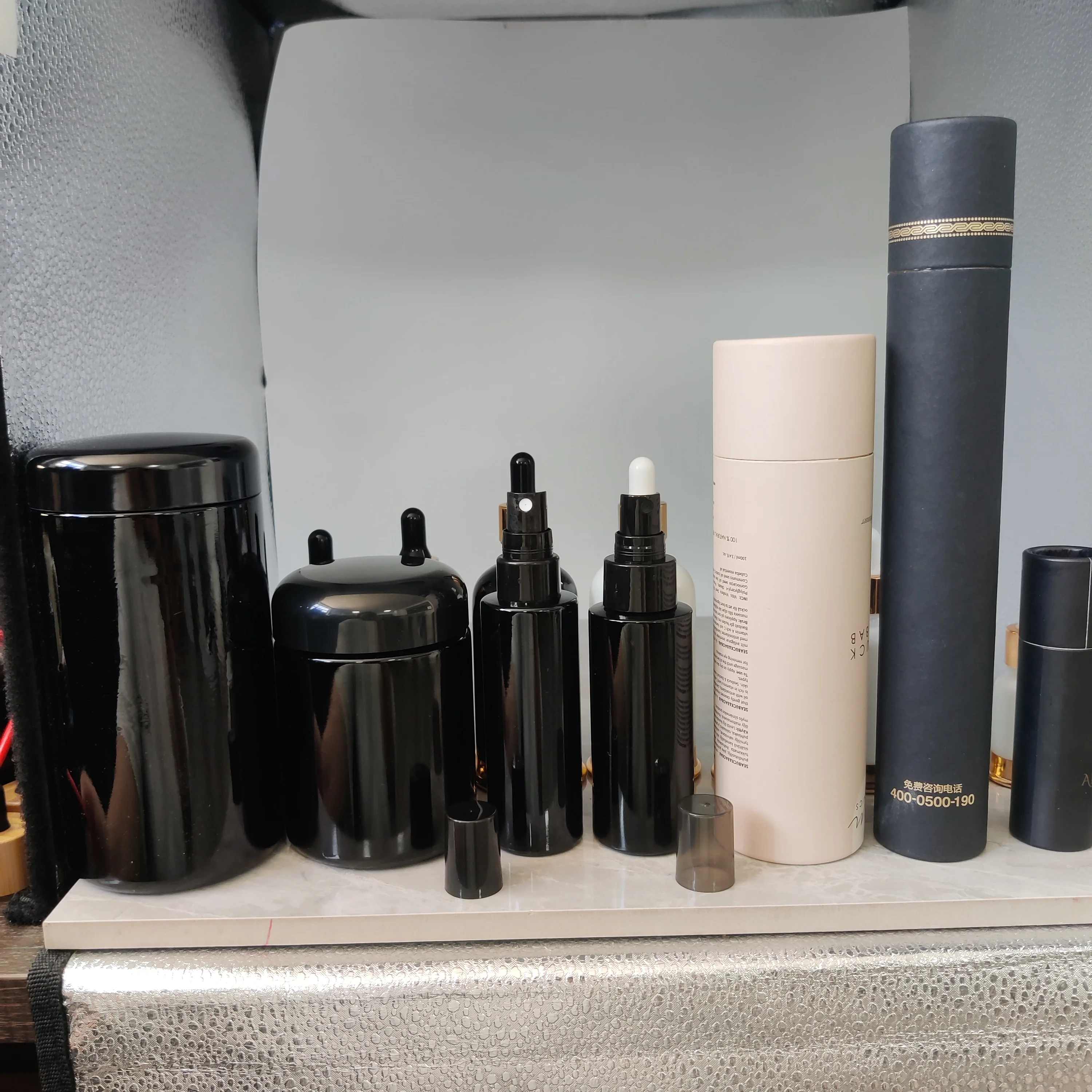 cosmetic packaging dark violet cylinder spray glass bottle