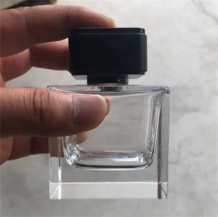 Manufacturer polishing 100ml glass perfume bottle with crimped shine silver atomizer top and  heavy luxury black ABS cap