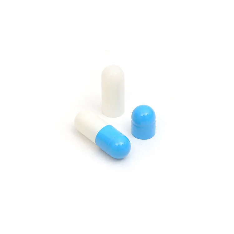 Separated size 1 empty gelatin capsules blue and white color