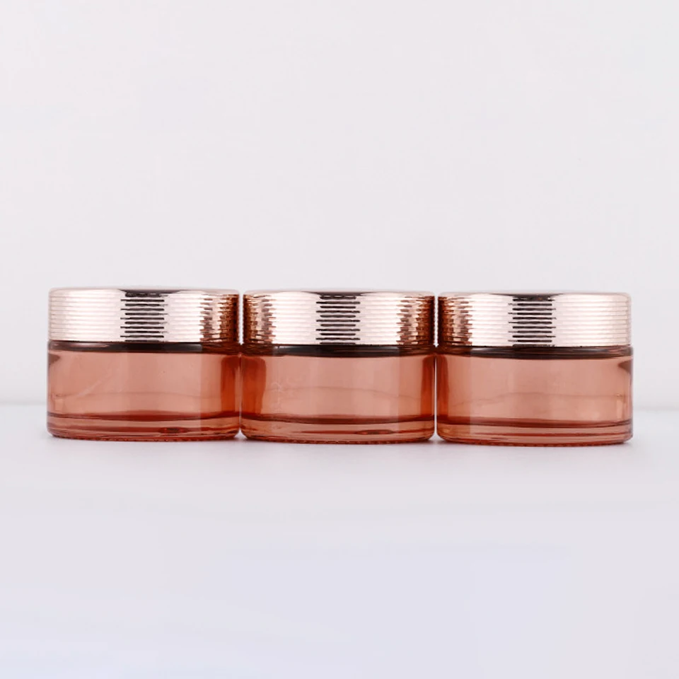 New product 5g 10g 15g 30g 50g 100g  clear pink glass cream jar with gold black sliver aluminium Cap Luxury skincare packaging